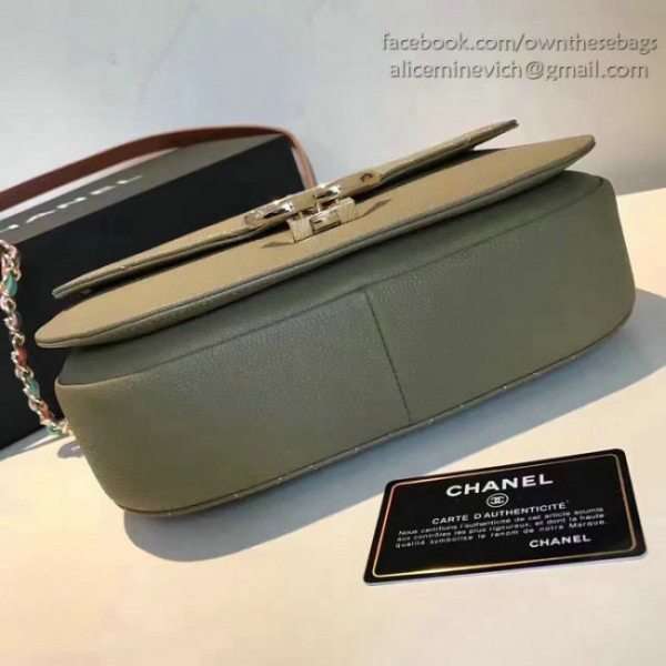 Ch**el grained calfskin flap bag with top handle green