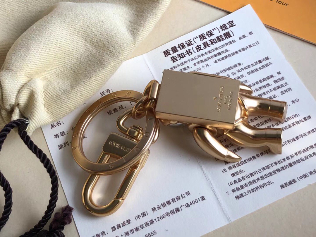 l0vis Vvtt0n spaceman hanging keychain golden